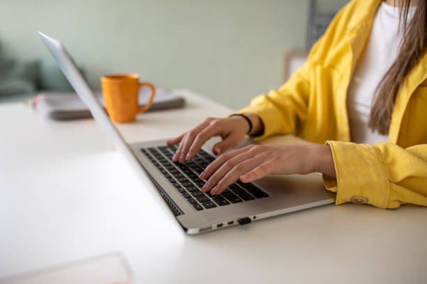 istock Young woman using a laptop in an office 2148109710