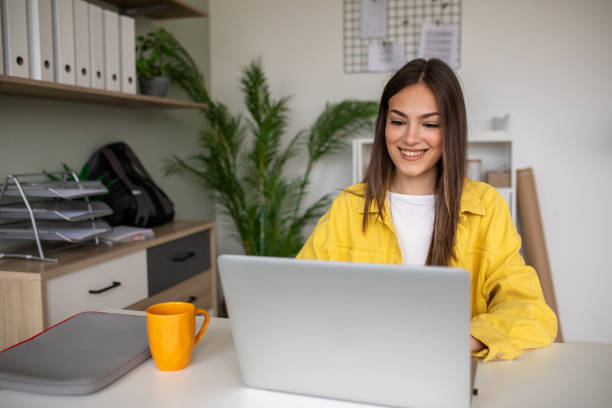 istock Young woman working on a laptop in the office 2148109732