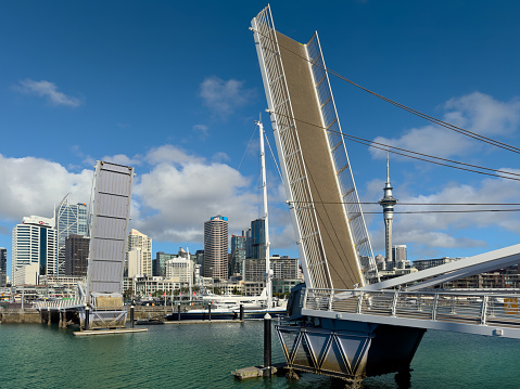 Auckland New Zealand, April 9, 2024: Due to a technical fault, the Wynyard Crossing Bridge is in the upright position and closed to pedestrians until further notice, causing disruptions for commuters and businesses.