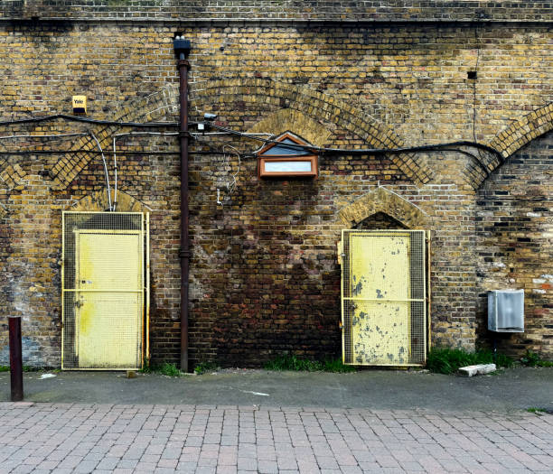 istock Two old yellow doors 2148112213