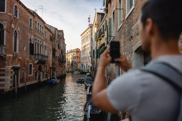 istock Tourist Capturing Venice Canal on Smartphone 2148114704