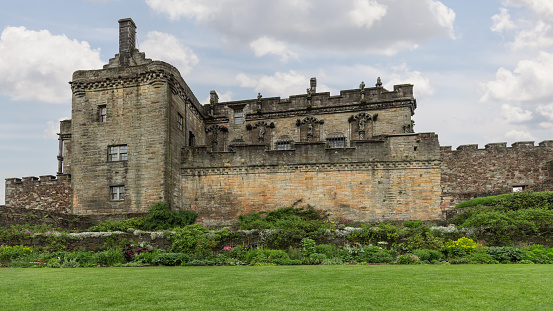 Stirling - United Kingdom. May 21, 2023: The grandeur of Stirling Castle is accentuated by lush gardens, showcasing Scotland rich tapestry of history and horticulture