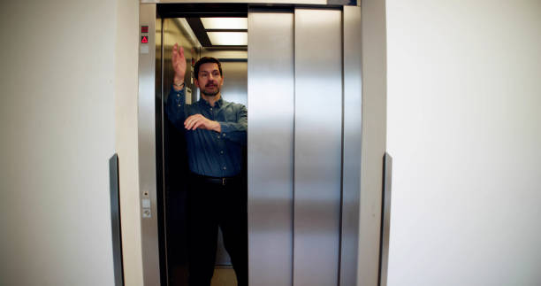 istock Man Trying To Stop Door 2148115737