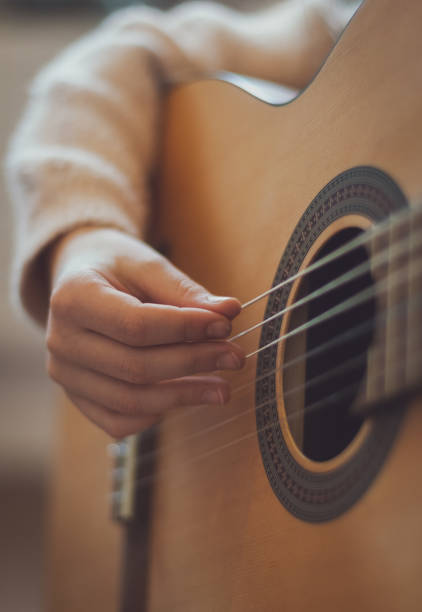 istock Little girl plays the guitar. 2148116121