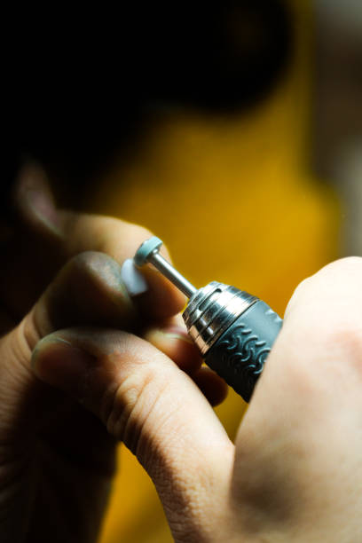 istock Master dental technician works on a new tooth 2148116724