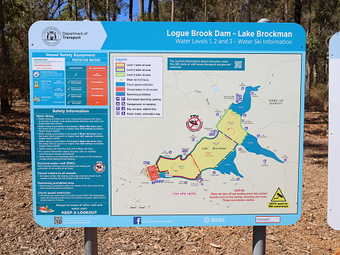 Information board, sign. Logue Brook Dam (Lake Brockman). Turquoise colored water.