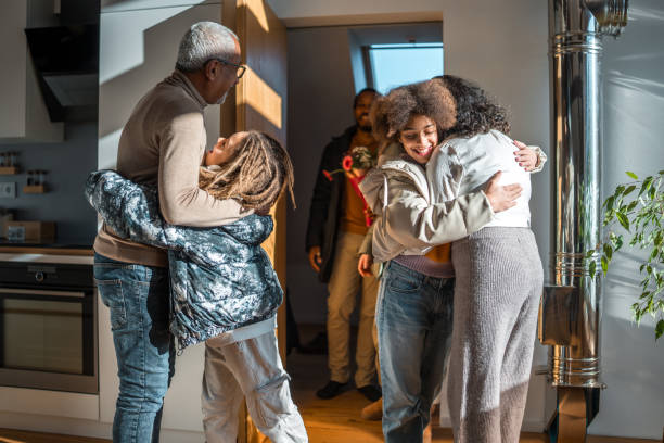 istock Multigenerational Diverse Family Greeting in Home Interior 2148117660