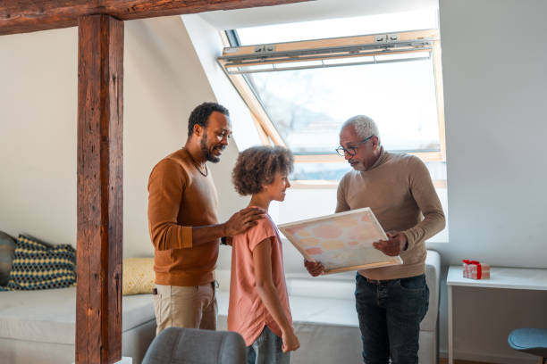istock Multiethnic Family Looking at Map Together Indoors 2148117724