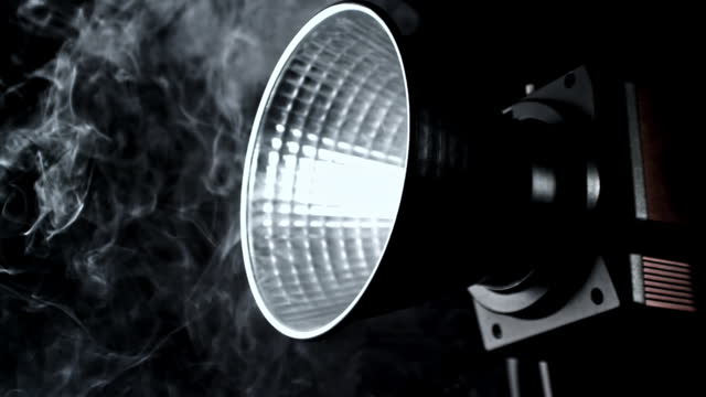 Super slow motion smoke in studio with lighting projector