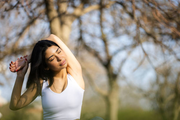 istock Young woman is meditating in nature. 2148118151