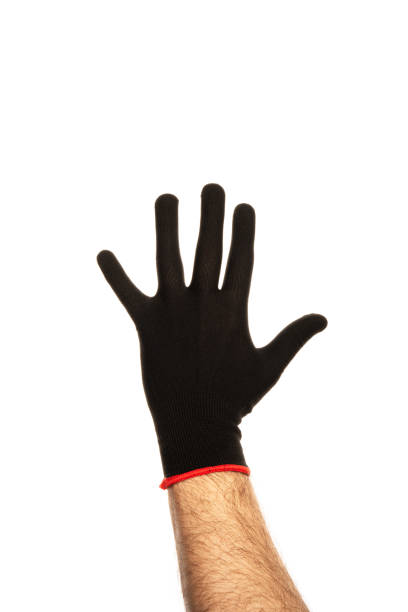 A man's hand in a black fabric work glove isolated on white background. High quality photo