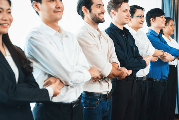 istock Business team standing, join and link hand together. Prudent 2148118664