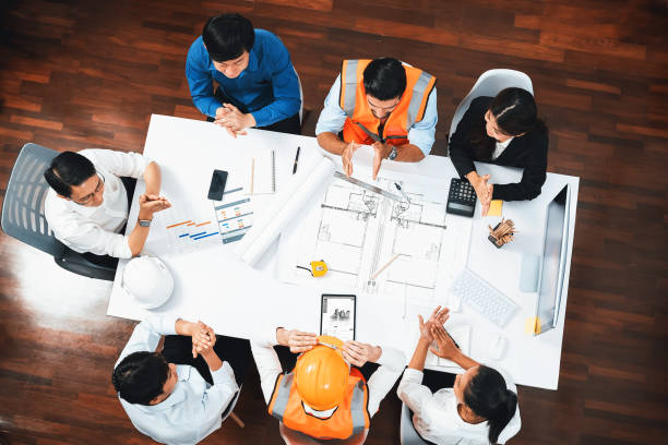 istock Diverse group of civil engineer and client working on architect. Prudent 2148119725
