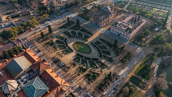 Aerial view of Carro de la Aurora fountain in Barcelona, Quadriga de l'Aurora on top of Font de la cascada, Ciutadella Park Fountain, Plaça de Sonia Rescalvo Zafra. Ciutadella Park. Barcelona, Spain. Neptune. Naixement of Venus

The Parc de la Ciutadella is a park on the northeastern edge of Ciutat Vella, Barcelona, Catalonia, Spain. For decades following its creation in the mid-19th century, this park was the city's only green space. The 31 hectares grounds include the Palau del Parlament de Catalunya, a small lake, and a large fountain designed by Josep Fontserè (with possible contributions by the young Antoni Gaudí).
As the location of the Parliament of Catalonia, the tensions in 2018 and 2019 regarding Catalan independence regularly led to the police closure of the park to public access to prevent crowds forming near to the official buildings.