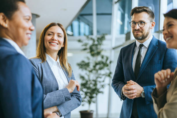 istock Group of colleagues talking together 2148122359