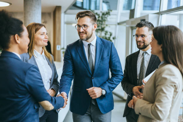 istock Business colleagues handshaking in discussion 2148122364