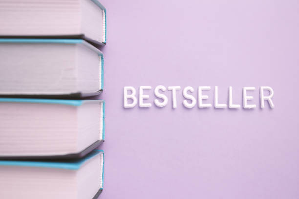 A stack of books with bestseller written on them in violet font on magenta and electric blue tints, creating a pattern of rectangles.