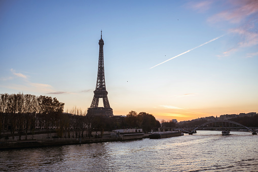 wide view on eiffel tower at seine river at blue hour