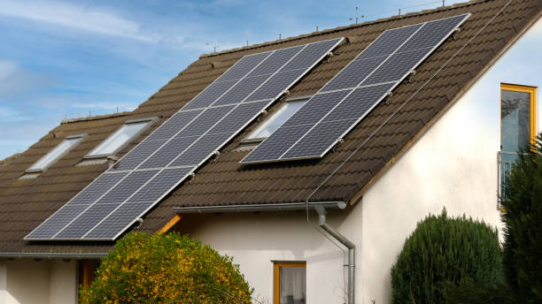 istock Home solar panel. Alternative energy is used for heating and water heating. Eco-friendly alternative energy for house. Residential family house suburban. Brown tile roof of home with solar panels. 2148123993