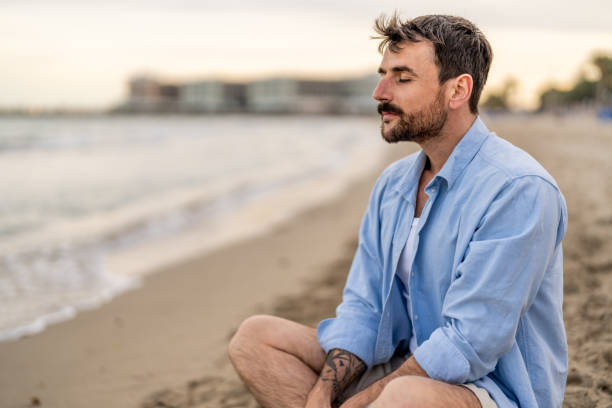 istock Relaxed man breathing fresh air on the beach. 2148124465