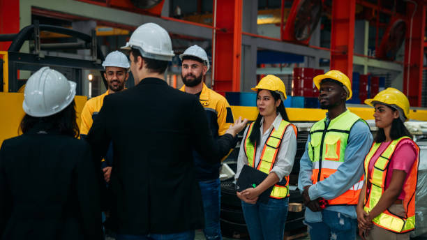 istock Team engineers and foreman stack hand and shake hands to show success at factory machines. Worker industry join hand for collaboration. 2148124844