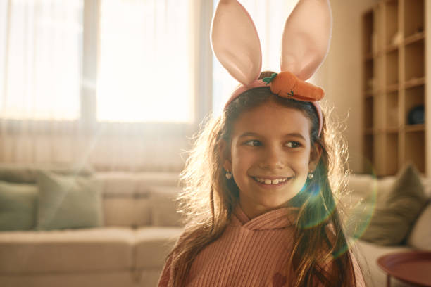 istock Cute girl wearing bunny ears 2148125882