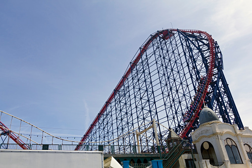Valencia, spain - May 20, 2022: the adrenaline shoots up in an exciting ride on a roller coaster, emotions to the fullest.