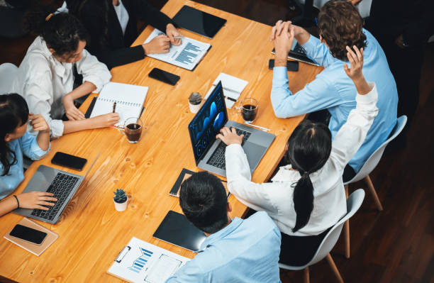 istock Analyst team actively engage in business meeting and asking question. Habiliment 2148127308