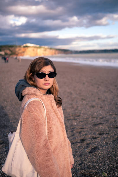 istock A young woman who left pessimistic and hopeless days behind 2148128470