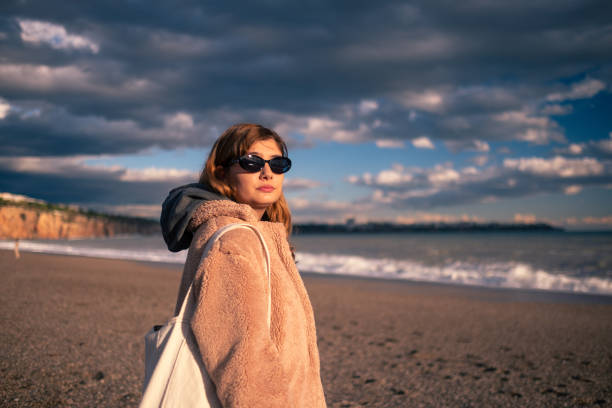 istock A young woman who left pessimistic and hopeless days behind 2148128471