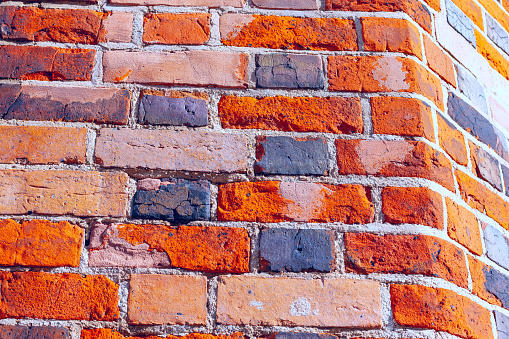 Brick wall as a captivating background. Red bricks backdrop