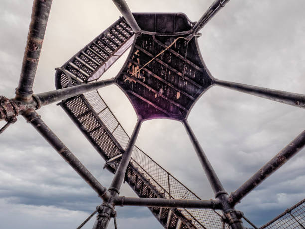 A view looking directly up from below the Eiffel Tower in Paris, showing the geometric design of the structure.