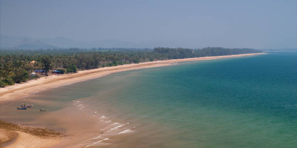 istock aerial view White beach with pine trees stretching as far as the eye can see. the long white beach. beautiful nature blue sky above turquoise sea and beach. 2148131356