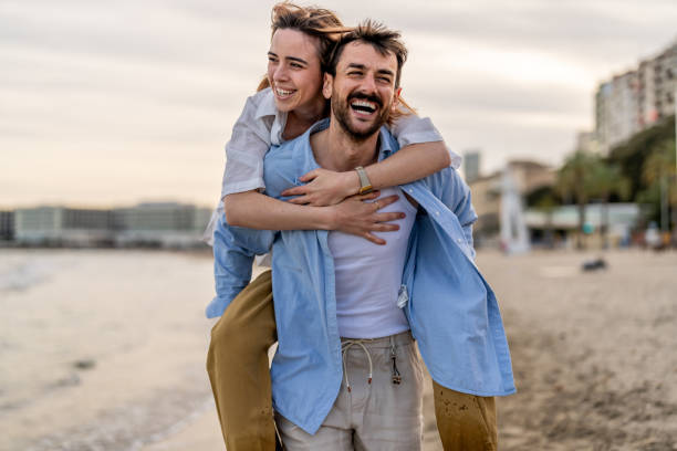 istock Man Giving Woman Piggyback 2148133375