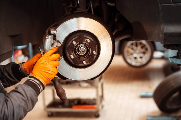 istock Unrecognizable man working on wheel brake pad 2148133744