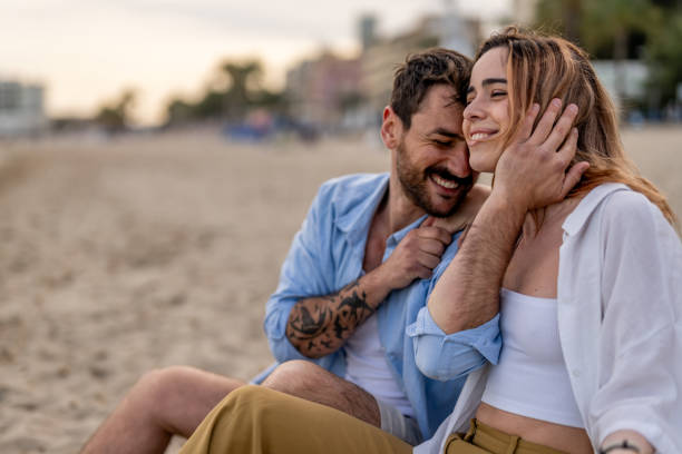 istock Young couple enjoying time on the beach 2148134716