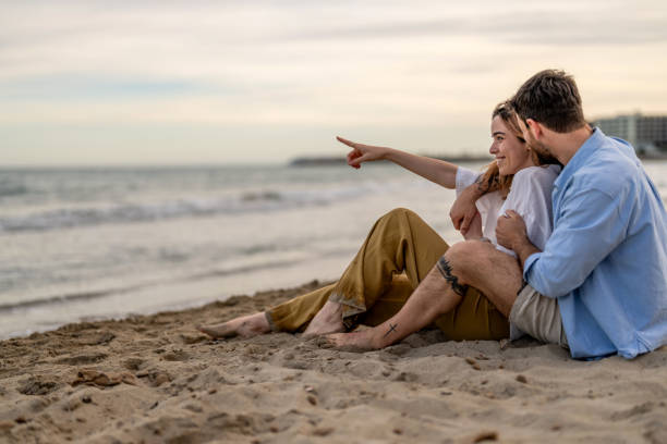 istock Affectionate young couple sharing an intimate moment at the beach 2148135407