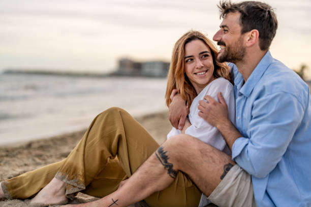 istock Cheerful affectionate husband hugging his wife while bonding on vacation outdoors 2148135485