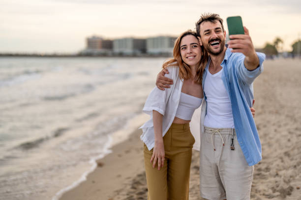 istock Young Couple Pose For Holiday Selfie 2148135636