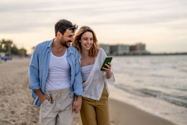 istock Couple sharing a message on the smart phone 2148135724