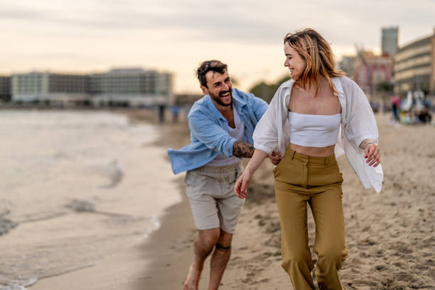 istock Happiness couple at the seaside walking on the beach 2148135803