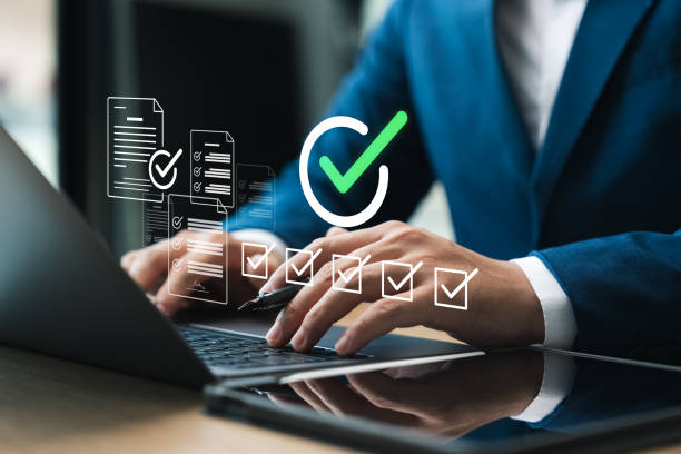 istock Business performance checklist, male businessman using laptop and tablet doing evaluation Online survey questionnaires, digital form checklists. 2148137162