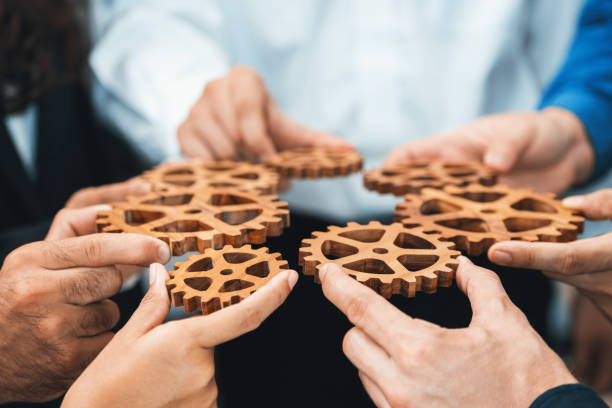 istock Business team joining cogwheel in circular together. Prudent 2148137320