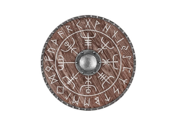istock Old wooden round shield decorated with runes isolated on white background 2148138855