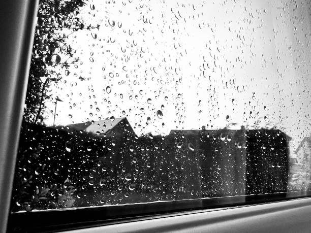 istock Raindrops on a domestic window on a rainy day 2148140100