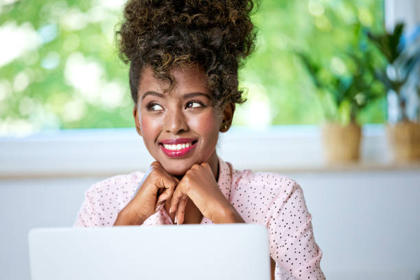 istock Beautiful woman working at home on laptop 2148141102