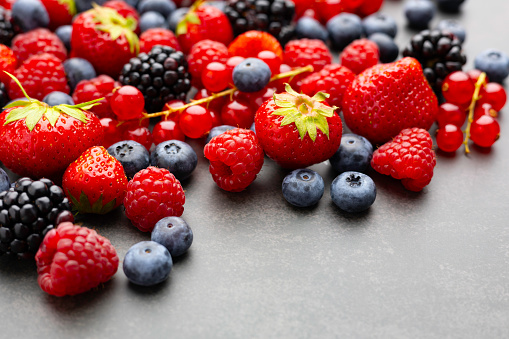 Berries. Various colorful berries Strawberry, Raspberry, Blackberry, Blueberry close-up Bio Fruits, Healthy eating, Vegan food, diet