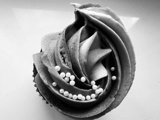 Swirls of frosted icing on a cupcake