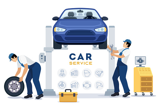 Automobile servicing and repair are currently in progress, with a car undergoing maintenance in a workshop alongside a dedicated team of mechanics.