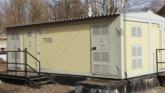 High voltage electrical transformer building, power distribution for neighboring houses